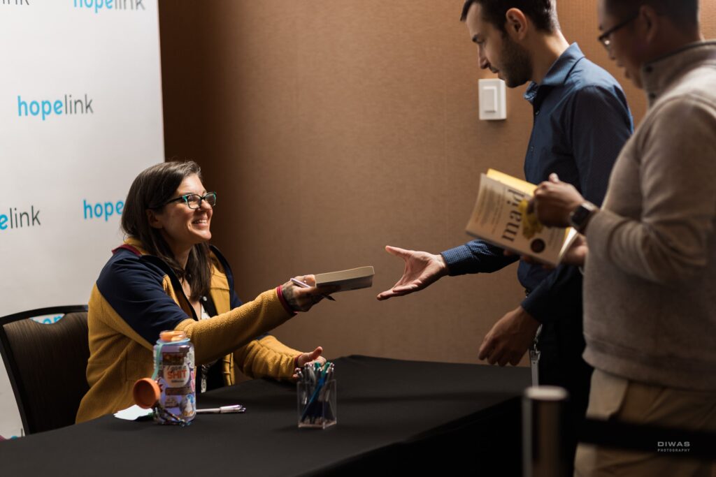 Immediately following the event, keynote speaker Stephanie Land hosted a book signing, giving participants a chance to get their copies of Maid or Class: A Memoir of Motherhood, Hunger, and Higher Education autographed at the Reaching Out Luncheon.